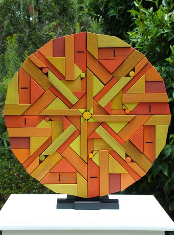 geometric timber mandala sculpture sun side